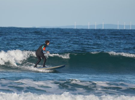Onze Instructeur Fenna tijdens Sup surf in de golven 